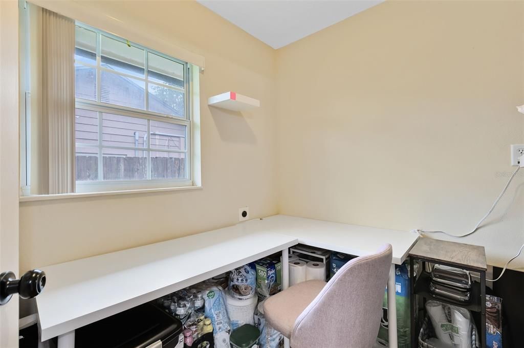 The pantry off the kitchen also features a built in area that would be ideal for a home office.