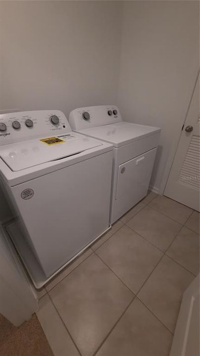 Laundry room with "Maytag"washer & dryer