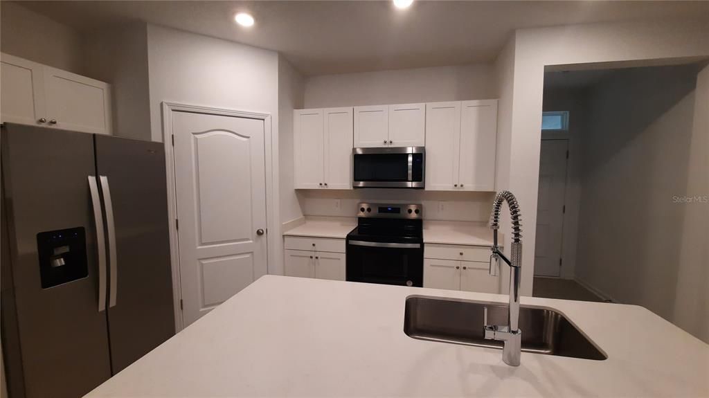 Large kitchen island with deep stainless steel sink