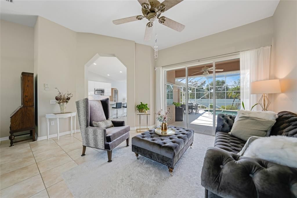 Sitting area with sliding doors out to the lanai and pool