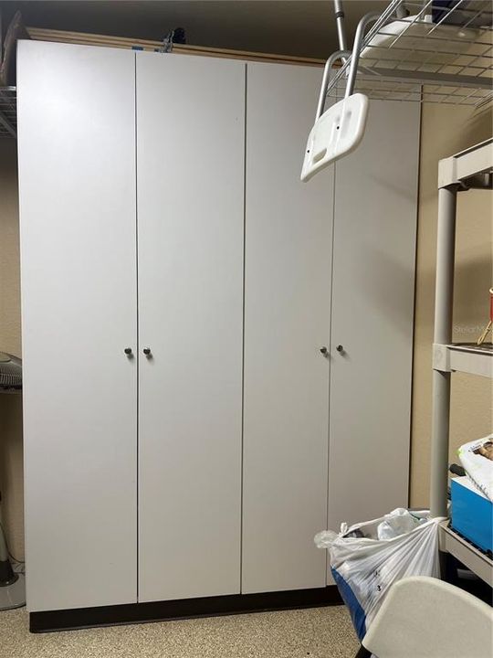 Cabinets in the garage for added storage.