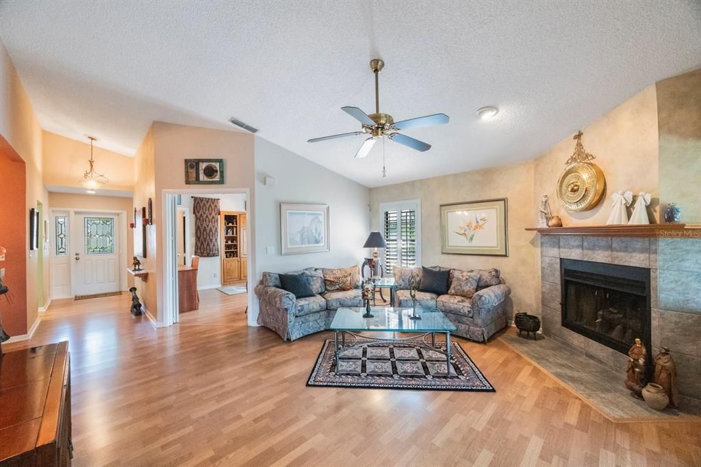 Light and bright, this expansive living/great room has a wood burning fireplace