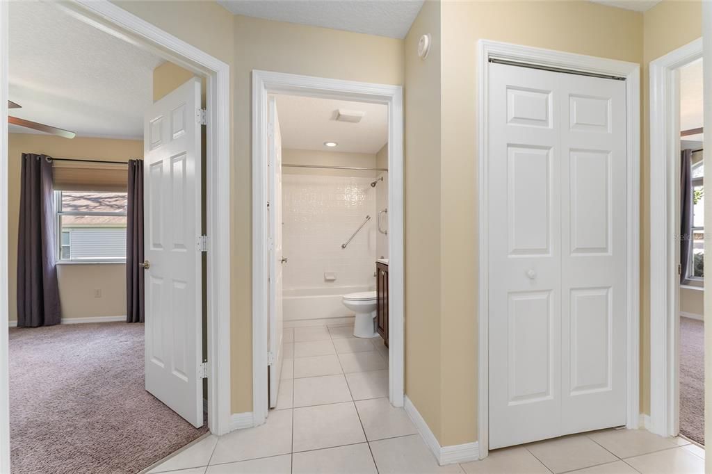 GUEST WING HALLWAY - BR 3 (L), BATHROOM @ (Center), Linen Closet (R), & Doorway to BR 2 (far right)