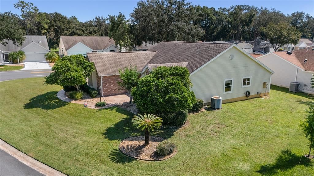 LOW AERIAL of west side of home