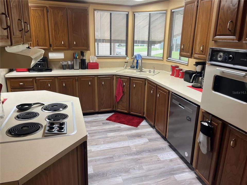 Huge Kitchen with built in oven, lots of wood cabinets and lots of countertops for all your meal preparation