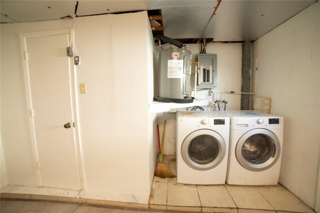 new hot water heater door to garage half bath, and washer and dryer