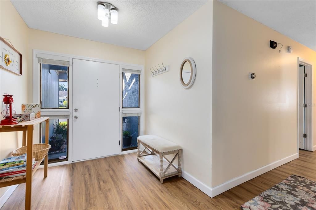 Upon entering, you'll be greeted by a bright and airy foyer.