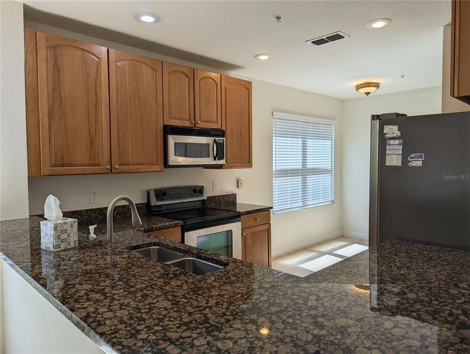 Kitchen features stainless steel appliances