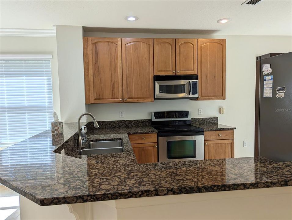 Kitchen features granite countertops