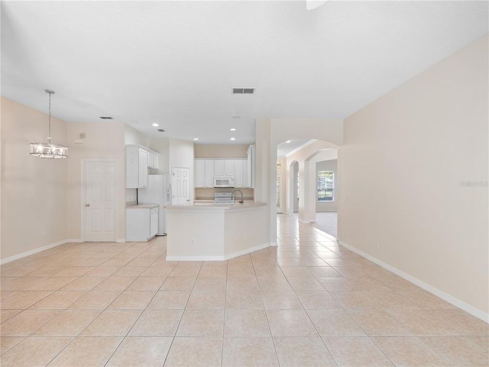 Open Family room/ kitchen dinette and kitchen with bar seating