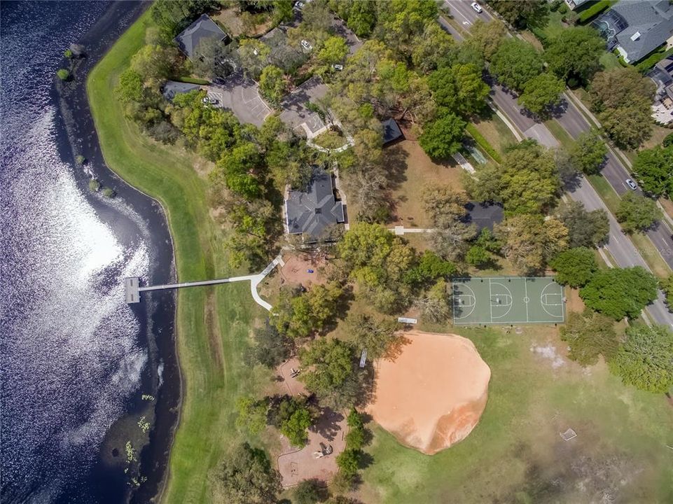 Aerial of Sawyer Lake Park in Heathrow.  Community amenities that include, basketball, baseball, playground, pier, and open fields.  There is also a recreational building available for community events.