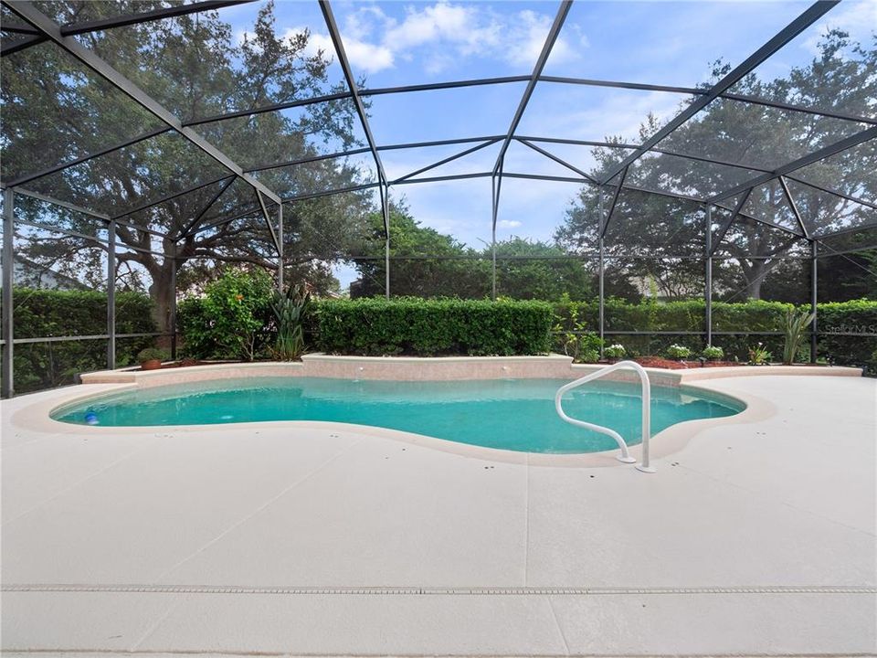 Large screened pool and lanai with decorative planters