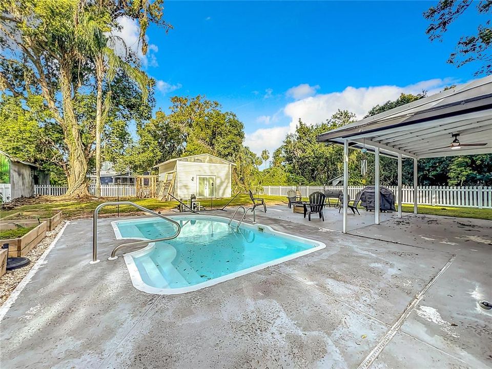 pool and large back yard entertainment space