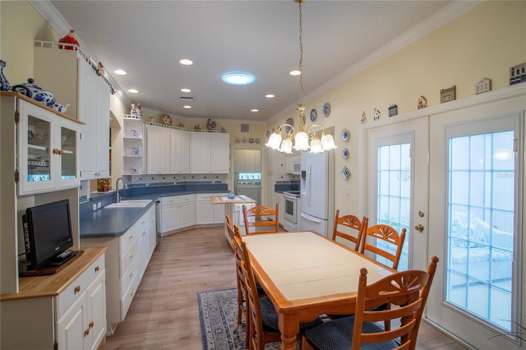 Kitchen and Eating Space with French Doors to Screened Patio