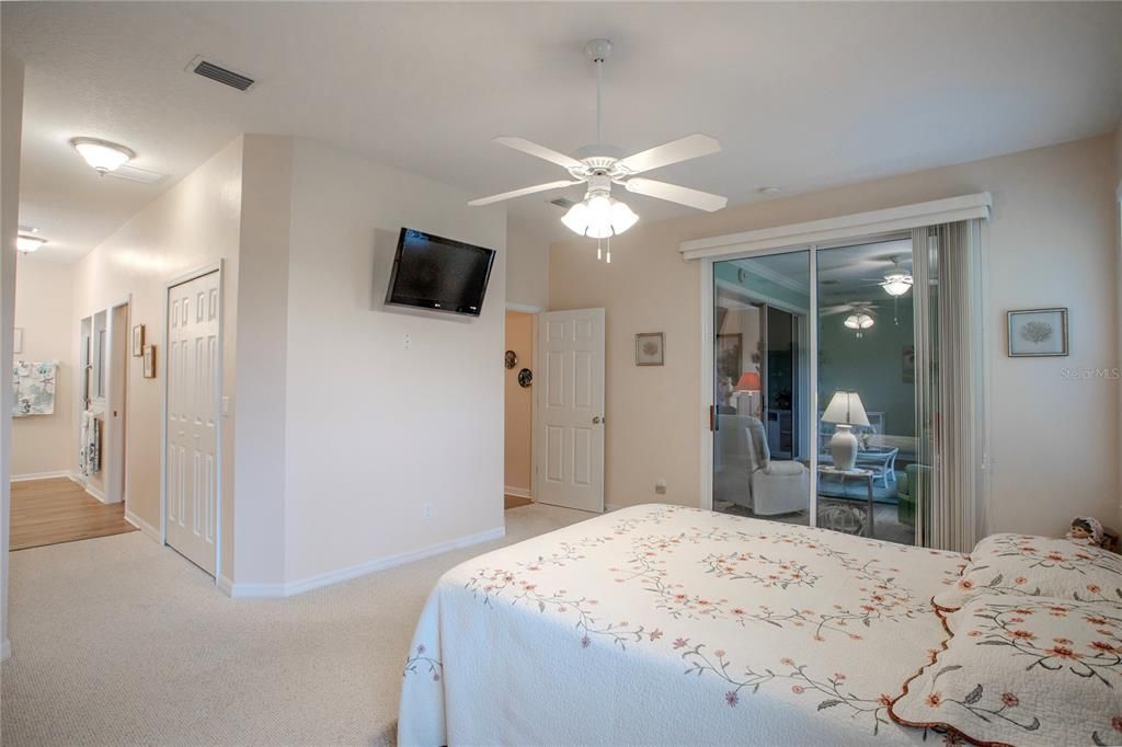 Primary Bedroom.  Sliding doors to Florida Room