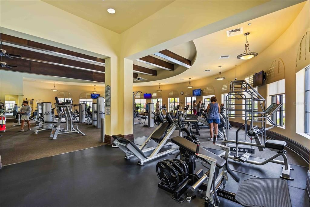 Fitness center overlooking resort pool