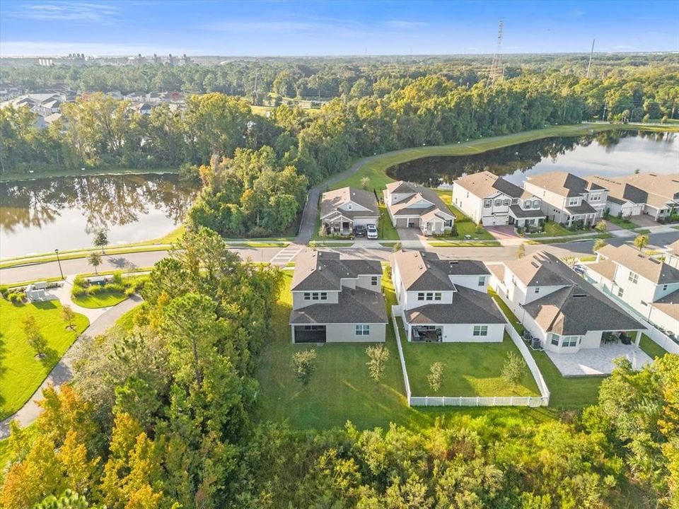 The paver driveway, covered front porch (with pond views!) and stylish details make you feel at home from the moment you pull in and the landscaping has been thoughtfully designed to compliment it all.