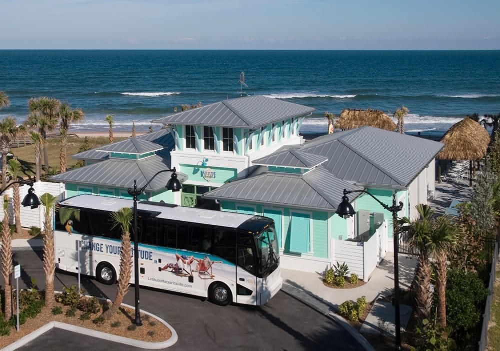 Bus will drive you to the beach club entrance. You can bring whatever you want on the bus.