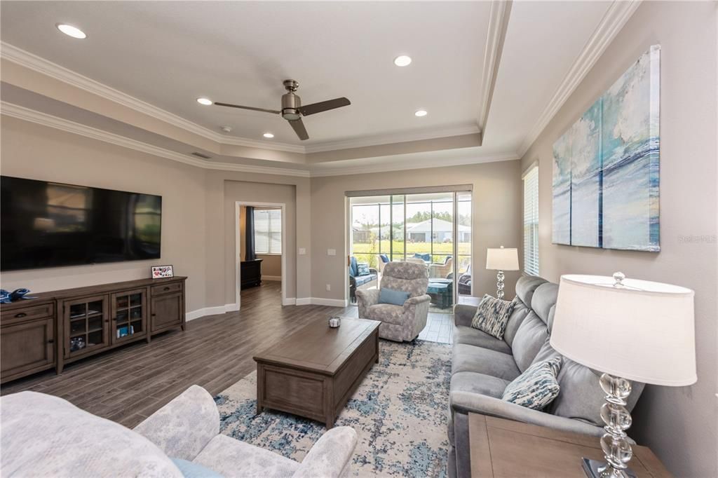 Kitchen opens up into the family room. Tray ceiling upgraded with crown molding.