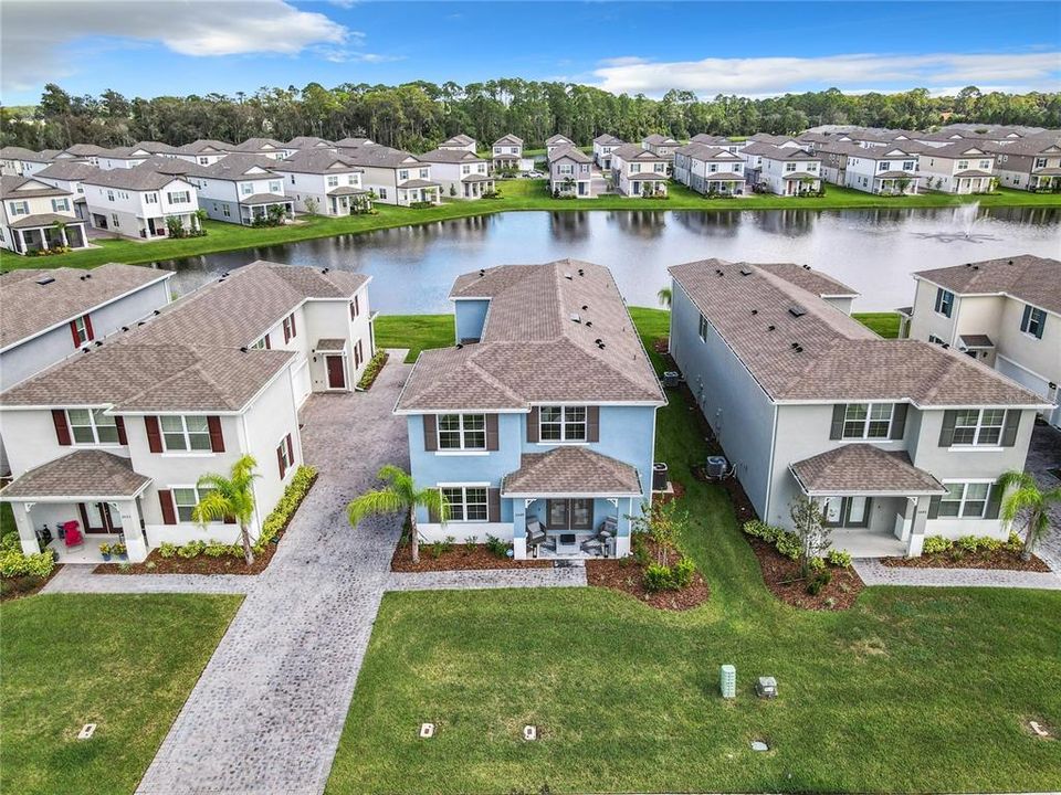 ariel of front of home with front patio and shared driveway