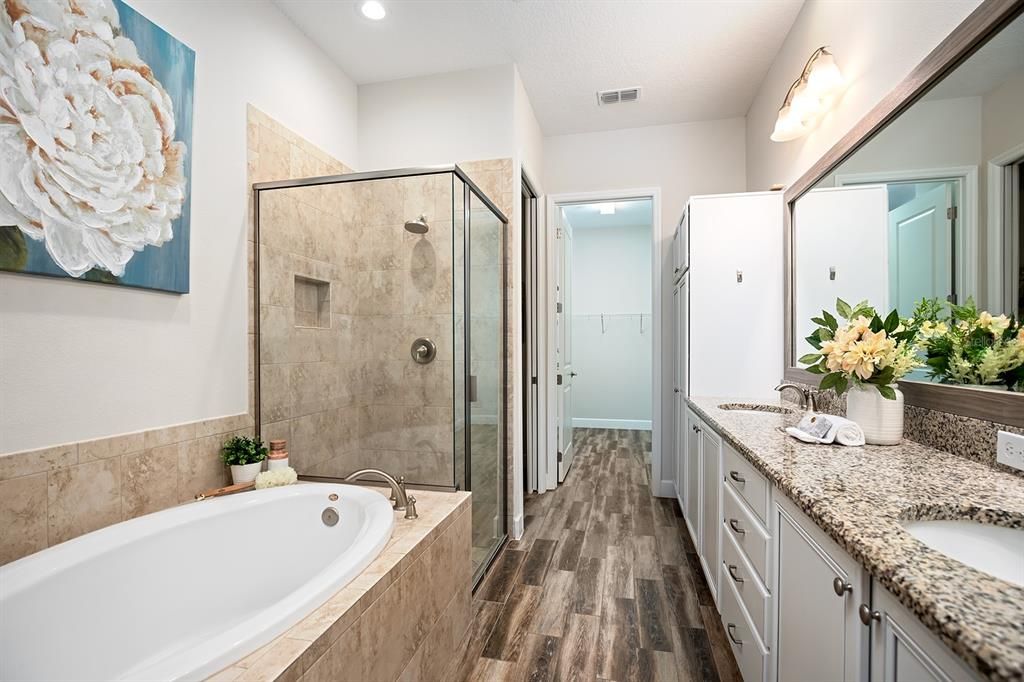 Primary bath leading to the oversized closet