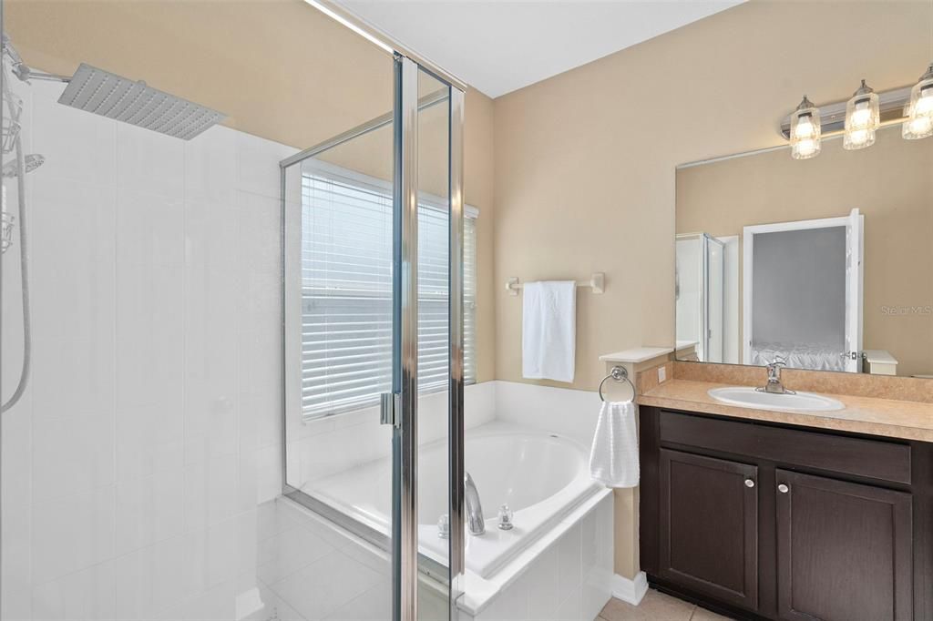 Master bathroom with  a soaking tub and a separate shower.