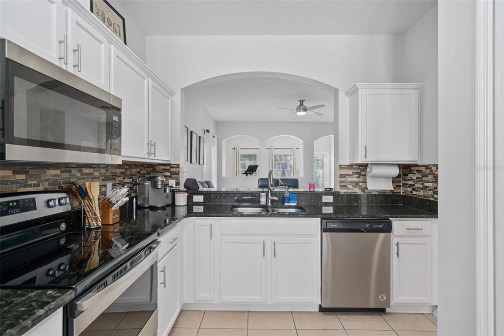 Beautifully Upgraded Kitchen with Granite Countertops and Plenty of Cabinet Space