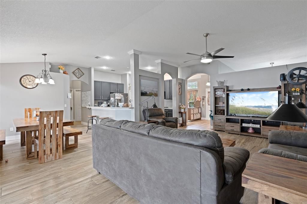 living dining combo with views from front door to rear sliders.