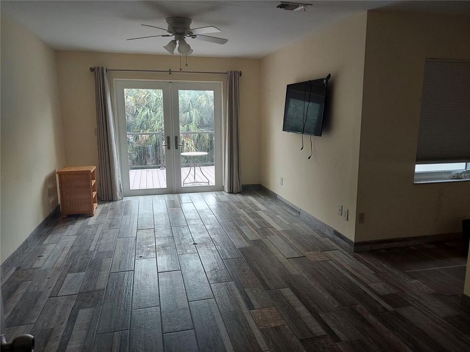 Primary Bedroom with impact slide doors to balcony