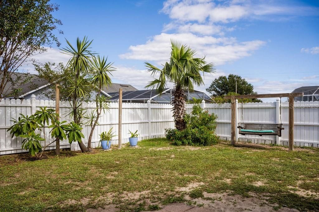 Backyard with Bench Swing