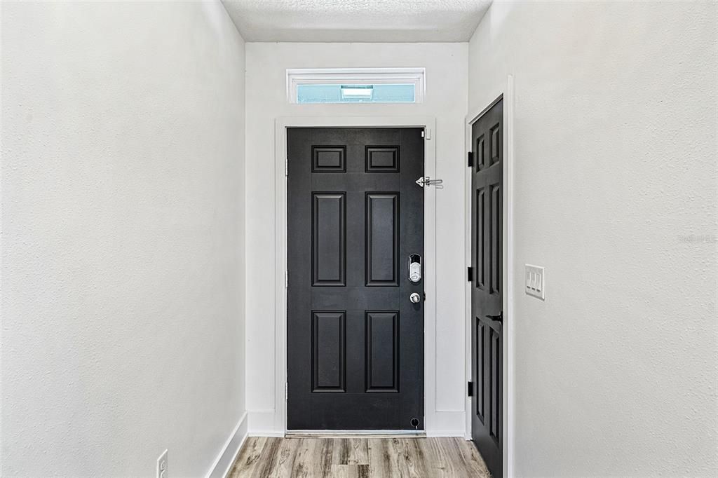 Front door with a coat closet