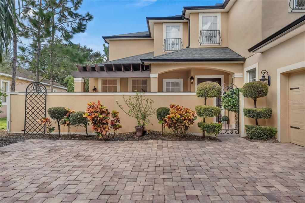 Notice the topiaries, Wrought Iron Gate & Accents