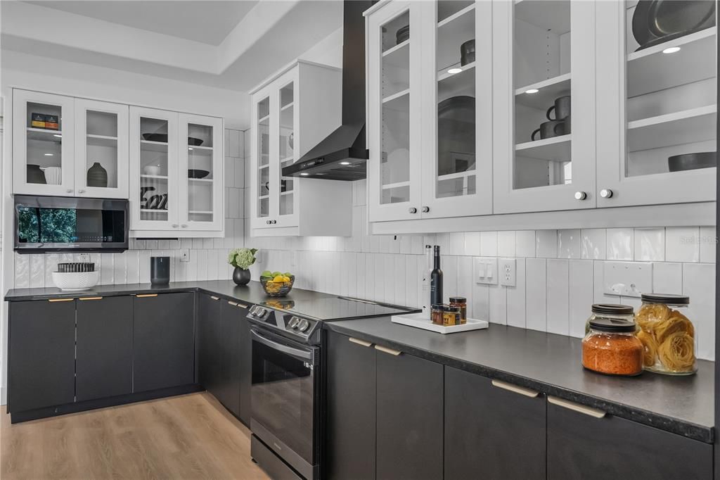 Black Tuscan Samsung Appliances and the Soft Close Drawers are Hidden Behind the Lower Cabinets