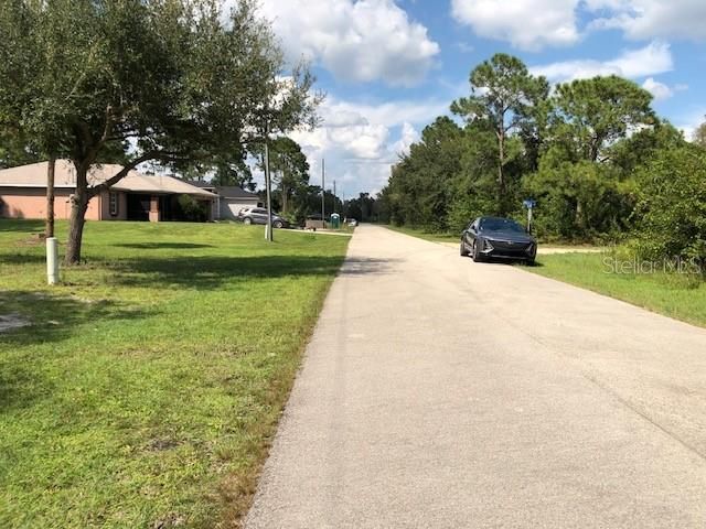 looking up the street from the lot