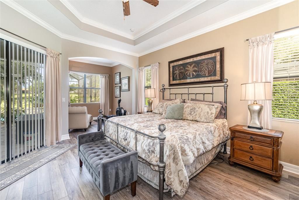 Master Bedroom and Sitting Area with views to the Pool and Golf Course beyond