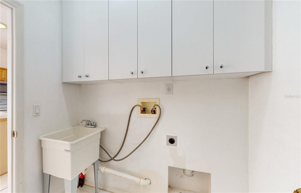 LAUNDRY ROOM WITH SINK AND STORAGE