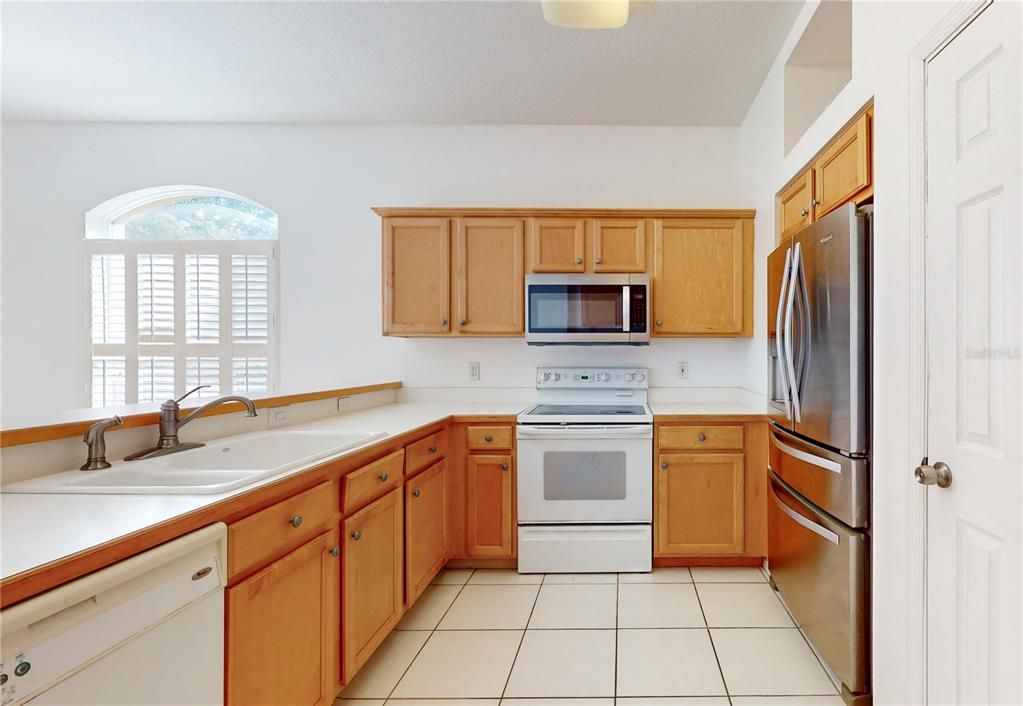 KITCHEN OPENS TO FAMILY ROOM