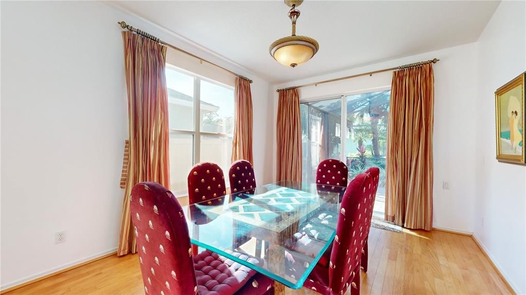 FORMAL DINING ROOM WITH SCREENED PORCH ACCESS