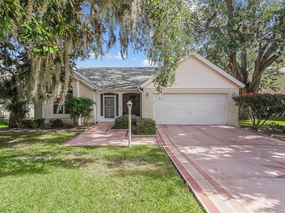 Front of the Home with a Painted Driveway and Walkway