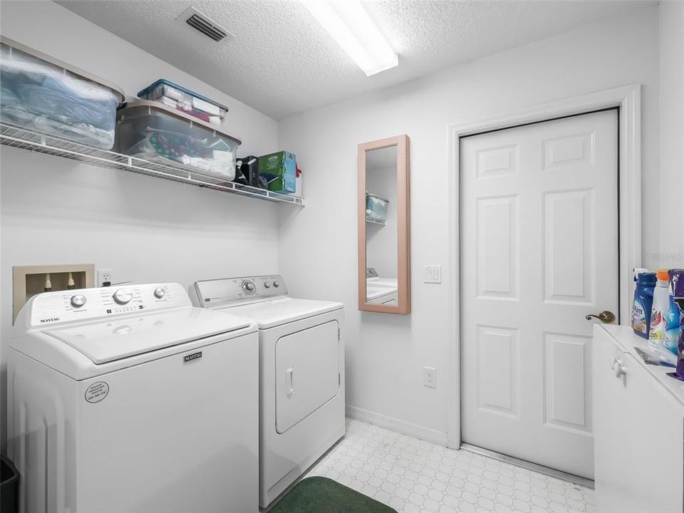 Interior Laundry Room with a Door to the Garage