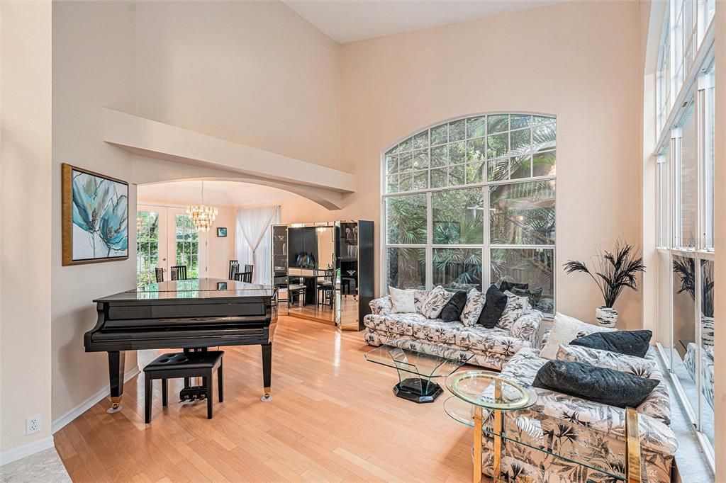 Large, UV coated windows surround the living room with natural light