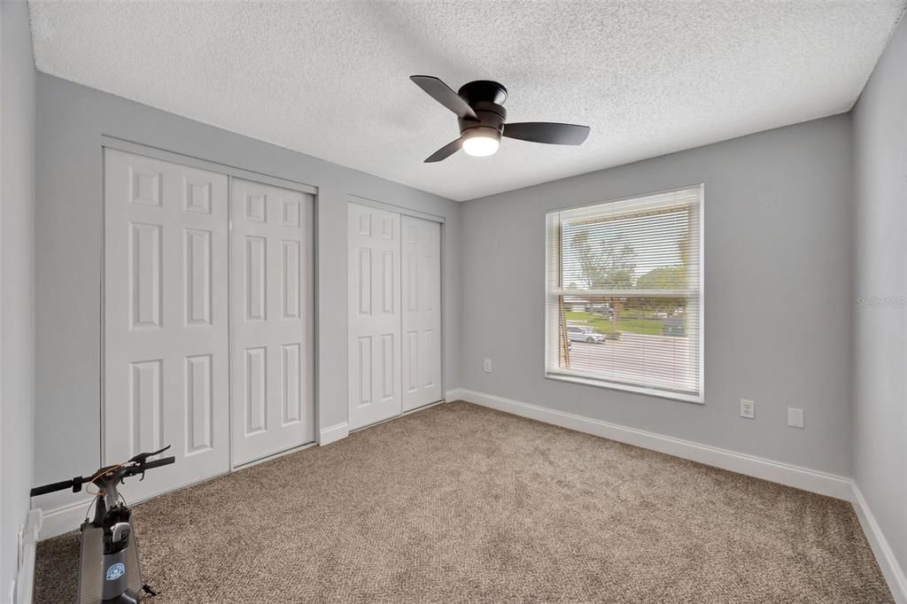 Secondary bedroom with two closets