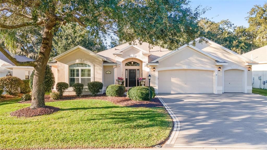 Two car garage, golf cart garage and painted driveway