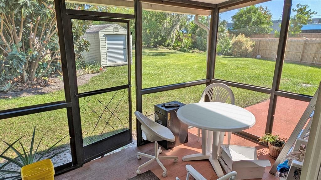 Your SCREENED BACK PORCH overlooks an Expansive Yard that goes WAAYYY Back (the Largest Lot in the Community) …with TWO Storage Sheds as Well! Bonus!