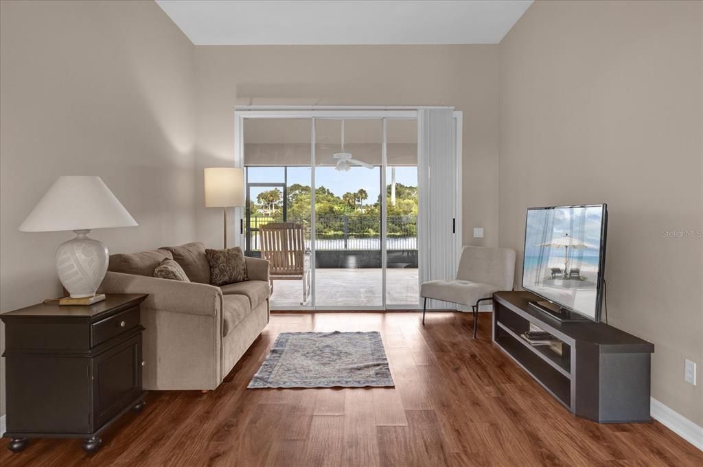 Formal Living Room overlooking rear patio and pond