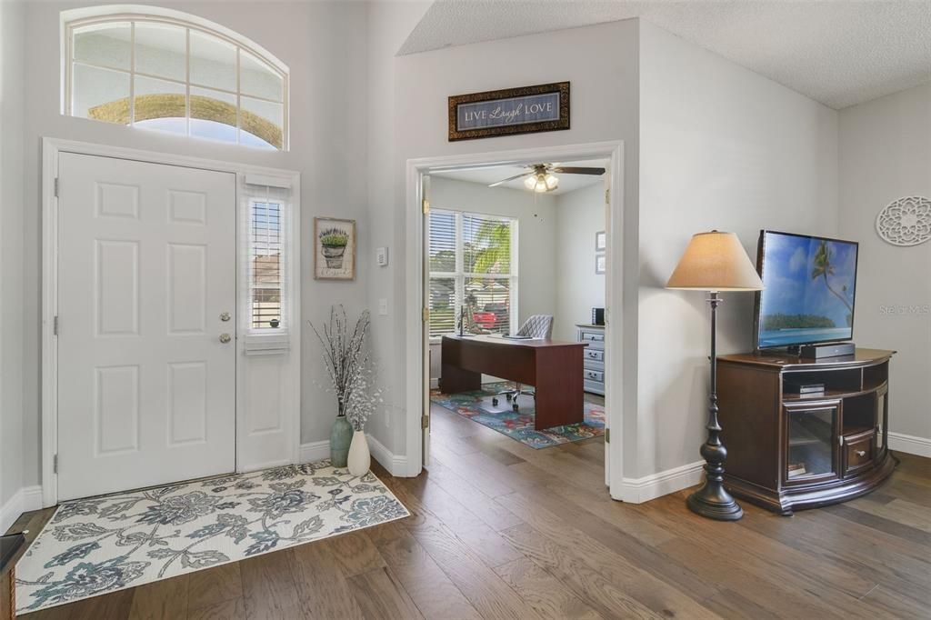 The foyer opens up to a light and bright flowing floor plan with an office/flex space at the front of the home behind double doors along with a versatile formal dining space to use however your family might need.