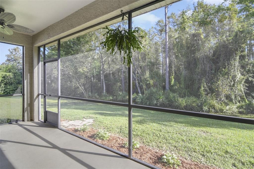 The large SCREENED LANAI gives you a place to enjoy the outdoors with no rear neighbors and a conservation view!