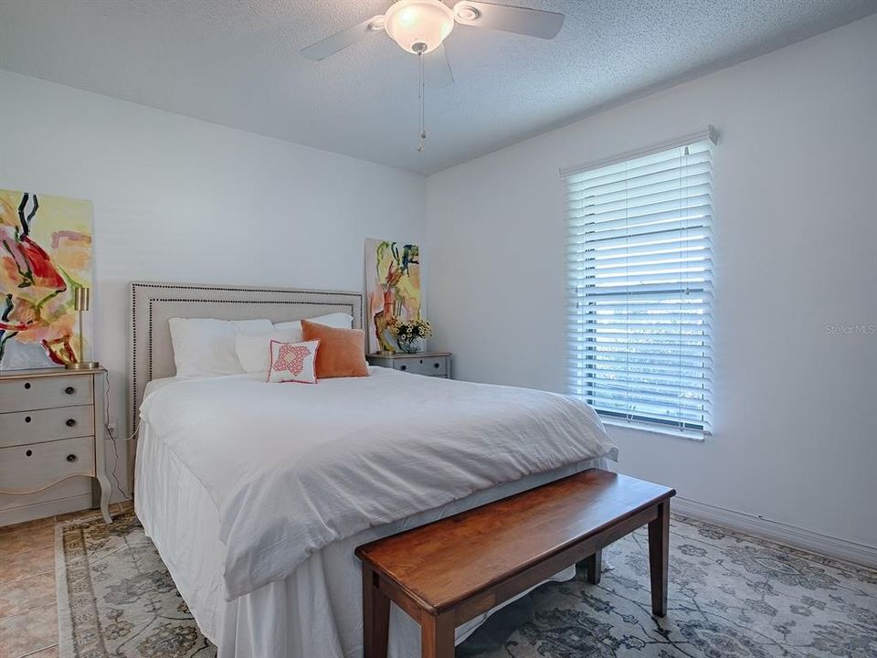 This primary suite affords privacy from the guest bedrooms ~