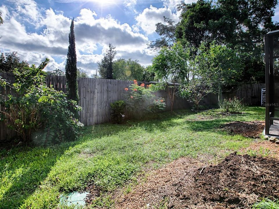 Fully fenced yard and attractive landscaping ~