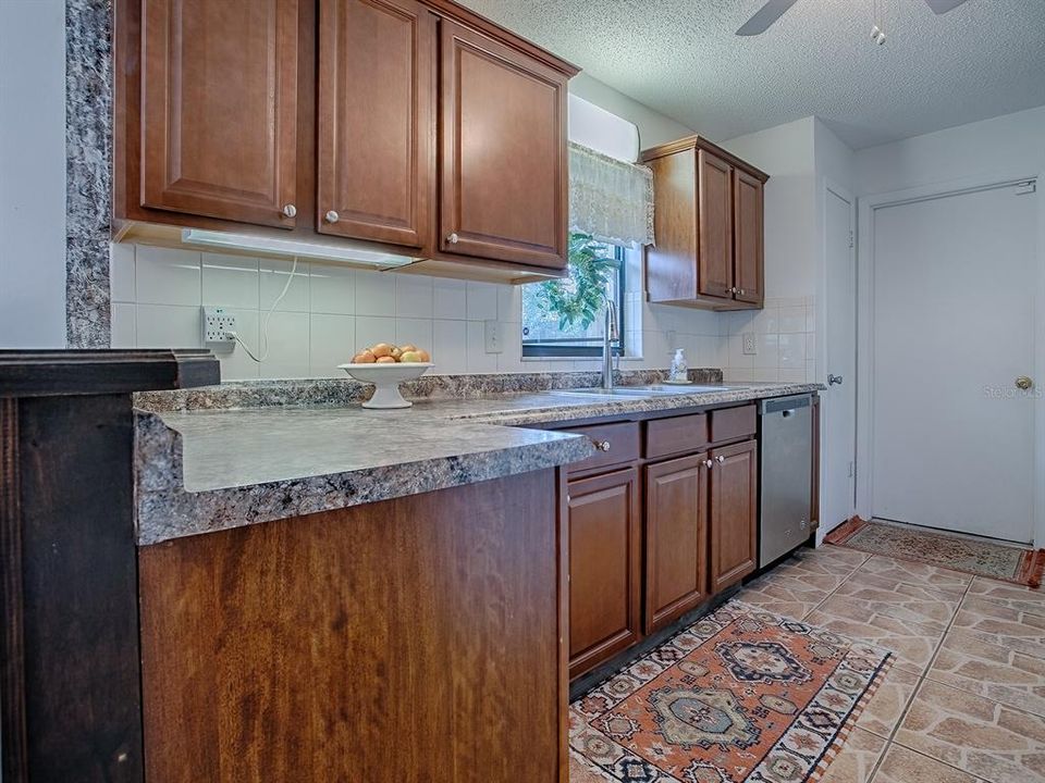 Plenty of counter space and cabinetry, and window over the sink ~